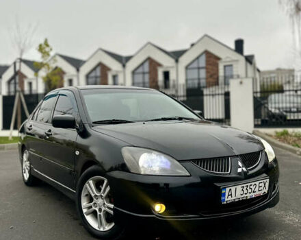 Черный Мицубиси Лансер, объемом двигателя 2 л и пробегом 260 тыс. км за 5300 $, фото 1 на Automoto.ua