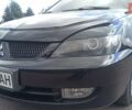 Черный Мицубиси Лансер, объемом двигателя 1.6 л и пробегом 345 тыс. км за 4800 $, фото 13 на Automoto.ua