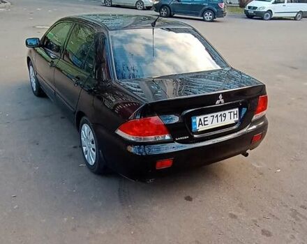 Чорний Міцубісі Lancer, об'ємом двигуна 1.6 л та пробігом 296 тис. км за 4500 $, фото 7 на Automoto.ua