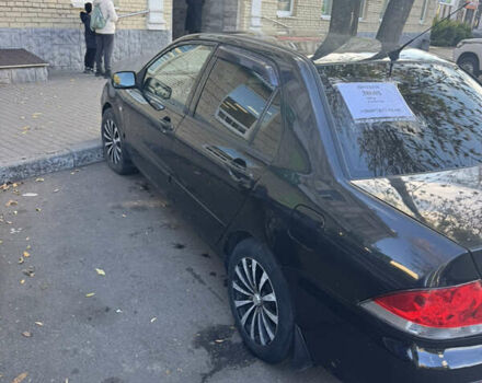 Чорний Міцубісі Lancer, об'ємом двигуна 1.58 л та пробігом 243 тис. км за 3800 $, фото 2 на Automoto.ua