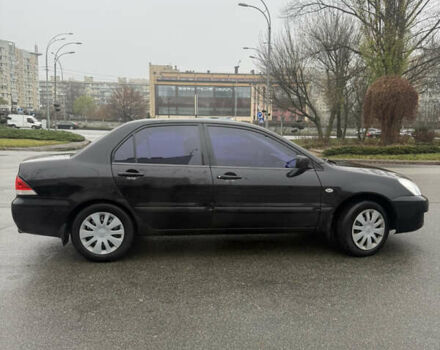 Чорний Міцубісі Lancer, об'ємом двигуна 1.58 л та пробігом 256 тис. км за 3700 $, фото 6 на Automoto.ua