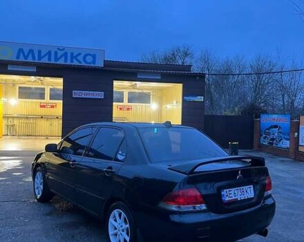 Черный Мицубиси Лансер, объемом двигателя 1.6 л и пробегом 249 тыс. км за 5000 $, фото 4 на Automoto.ua
