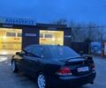 Черный Мицубиси Лансер, объемом двигателя 1.6 л и пробегом 249 тыс. км за 5000 $, фото 4 на Automoto.ua