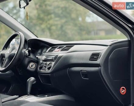 Чорний Міцубісі Lancer, об'ємом двигуна 1.6 л та пробігом 243 тис. км за 4950 $, фото 42 на Automoto.ua