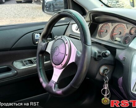 Черный Мицубиси Лансер, объемом двигателя 1.6 л и пробегом 260 тыс. км за 3700 $, фото 7 на Automoto.ua