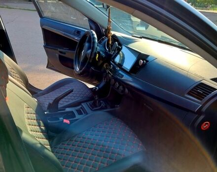 Черный Мицубиси Лансер, объемом двигателя 1.5 л и пробегом 215 тыс. км за 5600 $, фото 7 на Automoto.ua