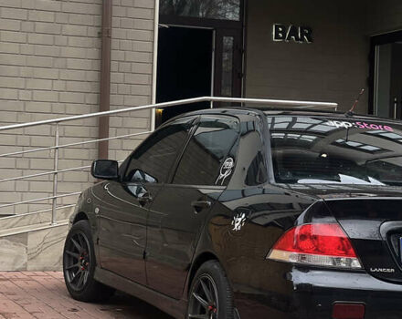 Черный Мицубиси Лансер, объемом двигателя 1.6 л и пробегом 211 тыс. км за 5700 $, фото 10 на Automoto.ua