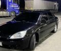 Черный Мицубиси Лансер, объемом двигателя 1.58 л и пробегом 200 тыс. км за 3300 $, фото 5 на Automoto.ua