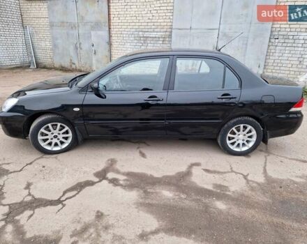 Чорний Міцубісі Lancer, об'ємом двигуна 1.6 л та пробігом 273 тис. км за 3999 $, фото 3 на Automoto.ua