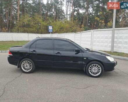 Чорний Міцубісі Lancer, об'ємом двигуна 1.58 л та пробігом 190 тис. км за 3750 $, фото 8 на Automoto.ua