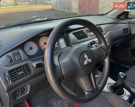 Черный Мицубиси Лансер, объемом двигателя 1.58 л и пробегом 156 тыс. км за 4599 $, фото 17 на Automoto.ua