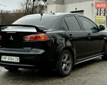 Черный Мицубиси Лансер, объемом двигателя 2 л и пробегом 215 тыс. км за 5500 $, фото 6 на Automoto.ua
