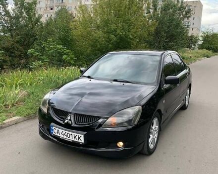 Чорний Міцубісі Lancer, об'ємом двигуна 2 л та пробігом 258 тис. км за 5200 $, фото 2 на Automoto.ua