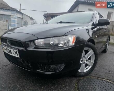 Черный Мицубиси Лансер, объемом двигателя 2 л и пробегом 116 тыс. км за 7200 $, фото 2 на Automoto.ua