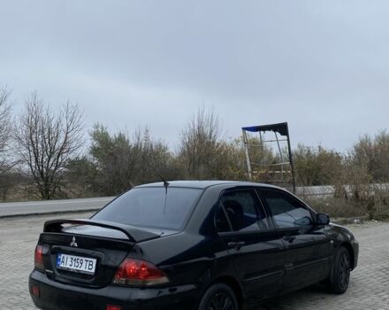 Черный Мицубиси Лансер, объемом двигателя 1.6 л и пробегом 263 тыс. км за 2900 $, фото 4 на Automoto.ua