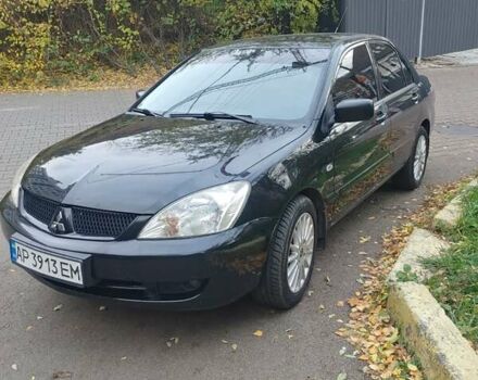 Чорний Міцубісі Lancer, об'ємом двигуна 1.58 л та пробігом 190 тис. км за 3750 $, фото 15 на Automoto.ua