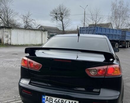 Черный Мицубиси Лансер, объемом двигателя 2 л и пробегом 350 тыс. км за 6700 $, фото 3 на Automoto.ua