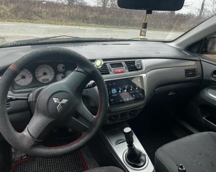 Черный Мицубиси Лансер, объемом двигателя 1.6 л и пробегом 272 тыс. км за 2800 $, фото 7 на Automoto.ua