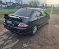 Чорний Міцубісі Lancer, об'ємом двигуна 2 л та пробігом 187 тис. км за 4800 $, фото 1 на Automoto.ua