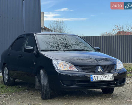 Чорний Міцубісі Lancer, об'ємом двигуна 1.58 л та пробігом 185 тис. км за 3750 $, фото 2 на Automoto.ua