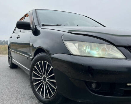 Чорний Міцубісі Lancer, об'ємом двигуна 1.6 л та пробігом 212 тис. км за 4700 $, фото 2 на Automoto.ua