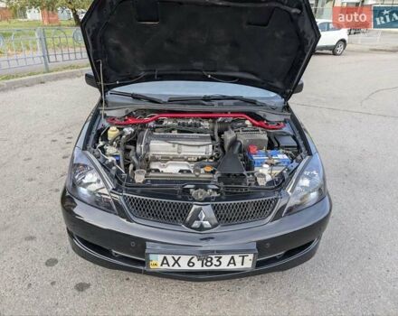 Чорний Міцубісі Lancer, об'ємом двигуна 2 л та пробігом 152 тис. км за 5500 $, фото 28 на Automoto.ua
