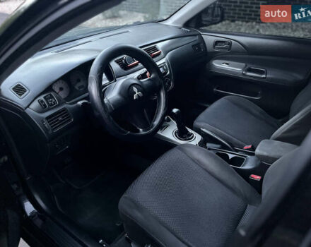 Черный Мицубиси Лансер, объемом двигателя 1.58 л и пробегом 278 тыс. км за 4800 $, фото 11 на Automoto.ua