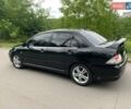 Чорний Міцубісі Lancer, об'ємом двигуна 2 л та пробігом 258 тис. км за 5200 $, фото 5 на Automoto.ua