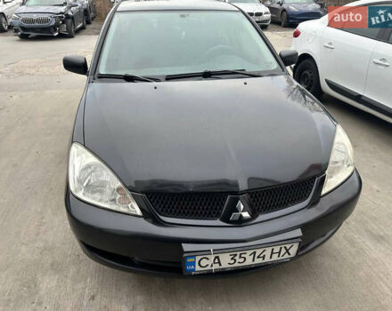 Черный Мицубиси Лансер, объемом двигателя 1.58 л и пробегом 290 тыс. км за 3000 $, фото 2 на Automoto.ua