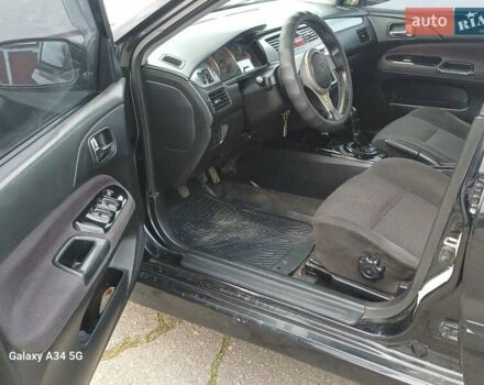 Черный Мицубиси Лансер, объемом двигателя 2 л и пробегом 286 тыс. км за 4000 $, фото 10 на Automoto.ua