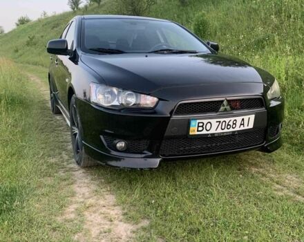 Черный Мицубиси Лансер, объемом двигателя 2 л и пробегом 208 тыс. км за 4300 $, фото 7 на Automoto.ua