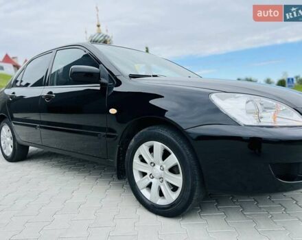Чорний Міцубісі Lancer, об'ємом двигуна 1.6 л та пробігом 243 тис. км за 4950 $, фото 15 на Automoto.ua