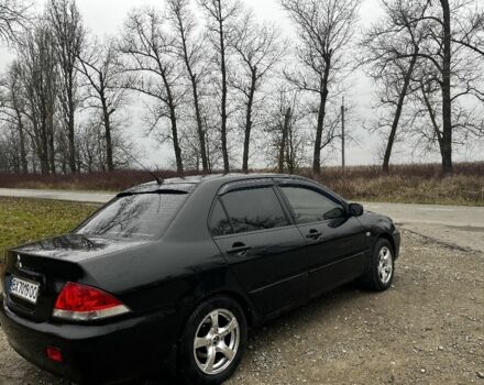 Черный Мицубиси Лансер, объемом двигателя 1.6 л и пробегом 272 тыс. км за 2800 $, фото 4 на Automoto.ua