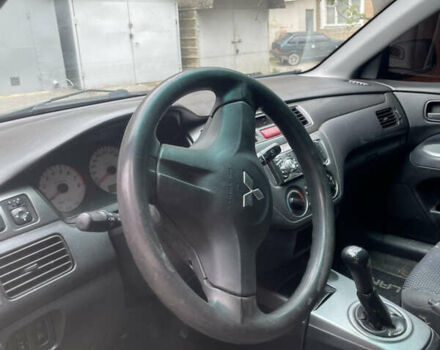 Черный Мицубиси Лансер, объемом двигателя 1.6 л и пробегом 258 тыс. км за 2999 $, фото 4 на Automoto.ua