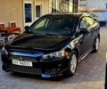 Черный Мицубиси Лансер, объемом двигателя 2 л и пробегом 120 тыс. км за 7850 $, фото 1 на Automoto.ua