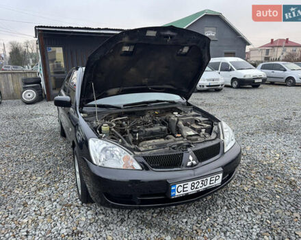 Черный Мицубиси Лансер, объемом двигателя 1.58 л и пробегом 202 тыс. км за 4100 $, фото 32 на Automoto.ua