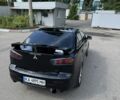 Черный Мицубиси Лансер, объемом двигателя 2 л и пробегом 145 тыс. км за 12000 $, фото 4 на Automoto.ua