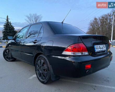 Чорний Міцубісі Lancer, об'ємом двигуна 1.58 л та пробігом 327 тис. км за 4000 $, фото 3 на Automoto.ua