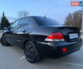 Чорний Міцубісі Lancer, об'ємом двигуна 1.58 л та пробігом 327 тис. км за 4000 $, фото 3 на Automoto.ua