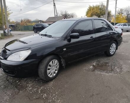 Черный Мицубиси Лансер, объемом двигателя 1.6 л и пробегом 270 тыс. км за 3800 $, фото 4 на Automoto.ua