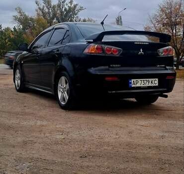 Черный Мицубиси Лансер, объемом двигателя 2 л и пробегом 211 тыс. км за 6900 $, фото 3 на Automoto.ua