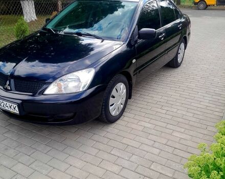 Черный Мицубиси Лансер, объемом двигателя 1.6 л и пробегом 206 тыс. км за 4200 $, фото 1 на Automoto.ua