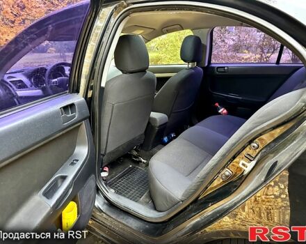 Чорний Міцубісі Lancer, об'ємом двигуна 2 л та пробігом 245 тис. км за 5500 $, фото 11 на Automoto.ua
