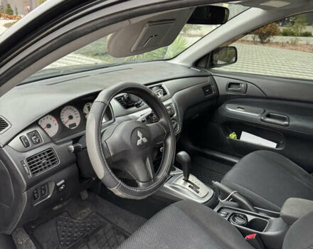 Черный Мицубиси Лансер, объемом двигателя 1.6 л и пробегом 240 тыс. км за 5200 $, фото 4 на Automoto.ua