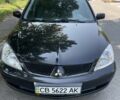 Чорний Міцубісі Lancer, об'ємом двигуна 1.6 л та пробігом 200 тис. км за 4797 $, фото 1 на Automoto.ua