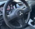 Черный Мицубиси Лансер, объемом двигателя 1.6 л и пробегом 225 тыс. км за 3400 $, фото 25 на Automoto.ua
