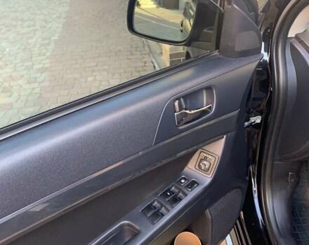 Черный Мицубиси Лансер, объемом двигателя 2 л и пробегом 210 тыс. км за 7000 $, фото 9 на Automoto.ua