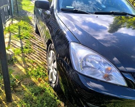 Черный Мицубиси Лансер, объемом двигателя 1.6 л и пробегом 232 тыс. км за 4400 $, фото 1 на Automoto.ua