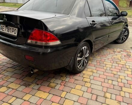 Чорний Міцубісі Lancer, об'ємом двигуна 1.6 л та пробігом 220 тис. км за 3600 $, фото 4 на Automoto.ua