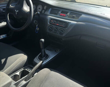 Черный Мицубиси Лансер, объемом двигателя 1.58 л и пробегом 205 тыс. км за 4500 $, фото 8 на Automoto.ua